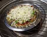 A picture of step 8 of Palak paneer parathapizza.