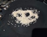 A picture of step 1 of Custard powder halwa with roasted sesame seeds.