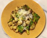 A picture of step 10 of Ricotta gnocchi with porcini and broccoli.