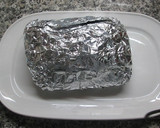 Foto del paso 4 de la receta: Lomo relleno de encurtidos dulces con patatas doradas