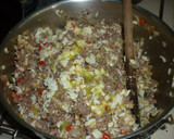 Foto del paso 4 de la receta: Zapallitos rellenos de carne y arroz