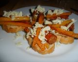 Foto del paso 9 de la receta: Tostadas con chistorra, patatas y queso