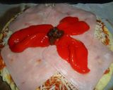 Foto del paso 6 de la receta: Pizza con york, morrones y pasas de uva