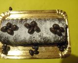 Foto del paso 5 de la receta: Budín con pasas chocolatadas y naranja