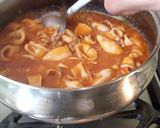 Foto del paso 7 de la receta: Arroz con calamarcitos en salsa