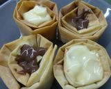 Foto del paso 5 de la receta: Tulipa de natillas con nata y fresas, kiwis o uvas bañada en chocolate