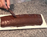 Foto del paso 16 de la receta: Brazo de gitano relleno de trufa y chocolate