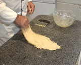 Foto del paso 6 de la receta: Coca de brioche con piñones