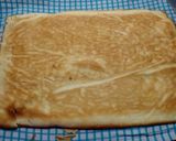 Foto del paso 4 de la receta: Brazo de gitano relleno de nata, dulce de leche y manzana