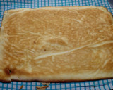 Foto del paso 4 de la receta: Brazo de gitano relleno de nata, dulce de leche y manzana