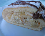 Foto del paso 10 de la receta: Brazo de gitano relleno de nata, dulce de leche y manzana