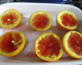 Foto del paso 5 de la receta: Naranjitas en almíbar rellenas de gelatina y frutas